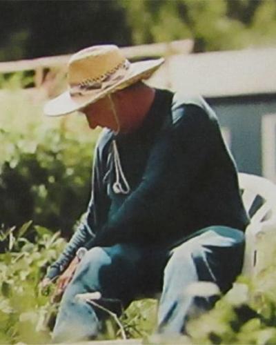 George Custalow working in Mattaponi garden